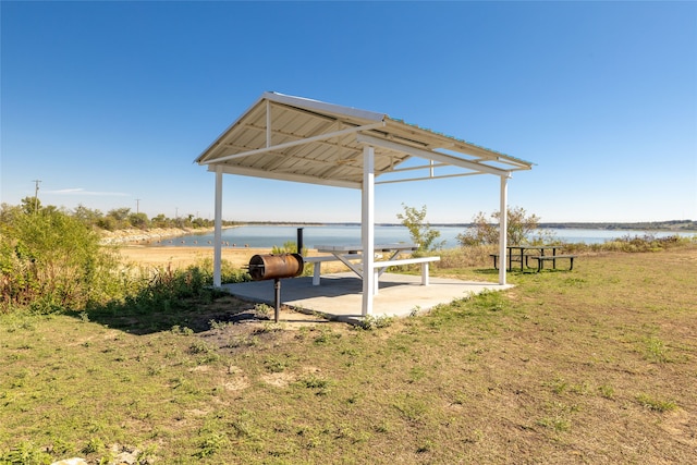 view of outdoor structure featuring a yard and a water view