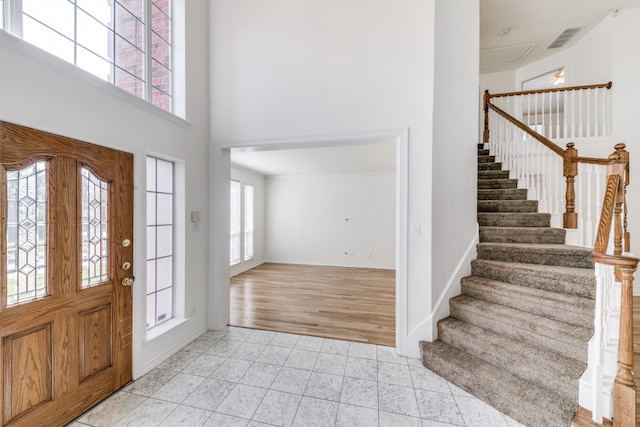 foyer entrance with light hardwood / wood-style floors