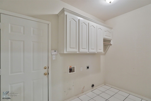 laundry area featuring hookup for a washing machine, light tile patterned floors, hookup for an electric dryer, and cabinets