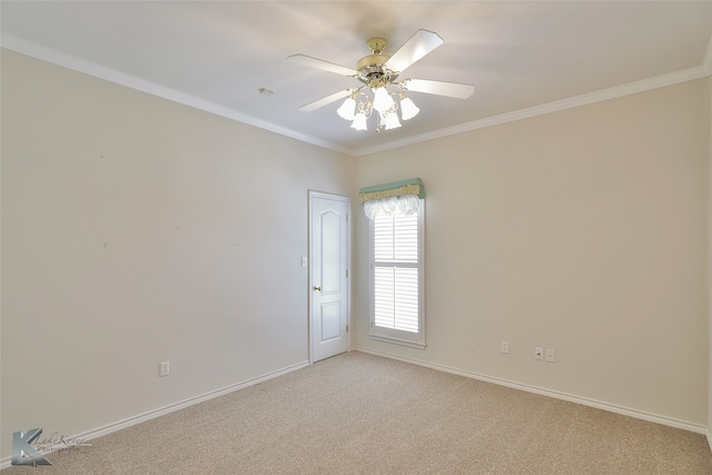 empty room featuring crown molding, ceiling fan, and light carpet