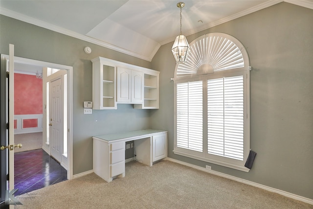 interior space featuring carpet flooring, crown molding, and vaulted ceiling