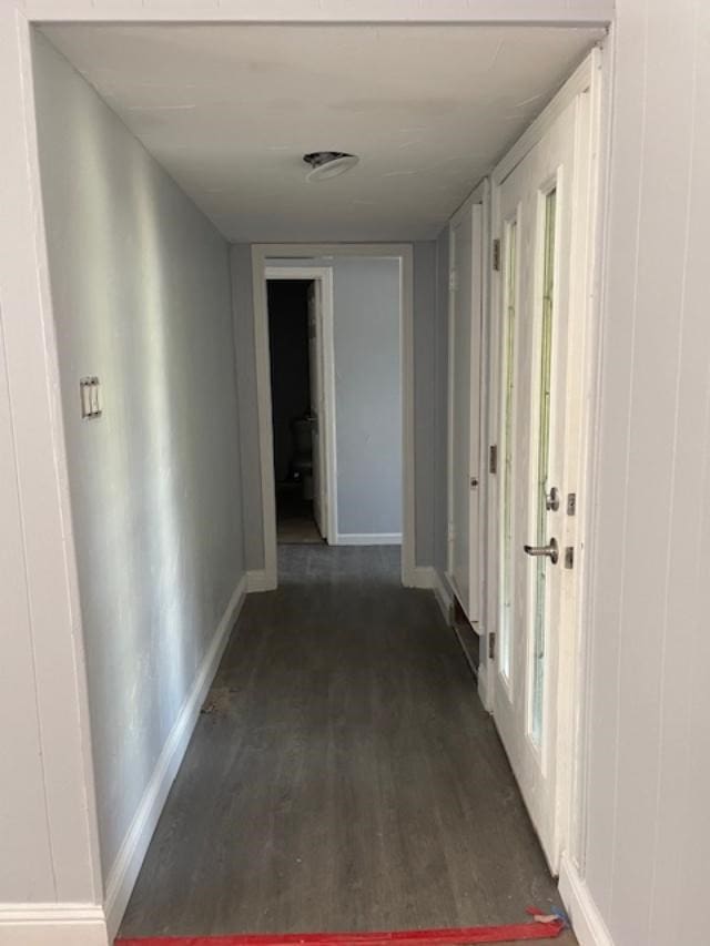 corridor with dark wood-type flooring