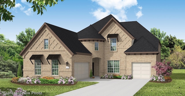 view of front of home featuring a garage and a front lawn