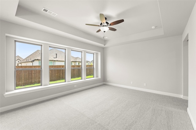 4100 Pond Cypress St, Aubrey, TX 76227 - carpeted spare room with a ceiling fan, baseboards, visible vents, and a raised ceiling