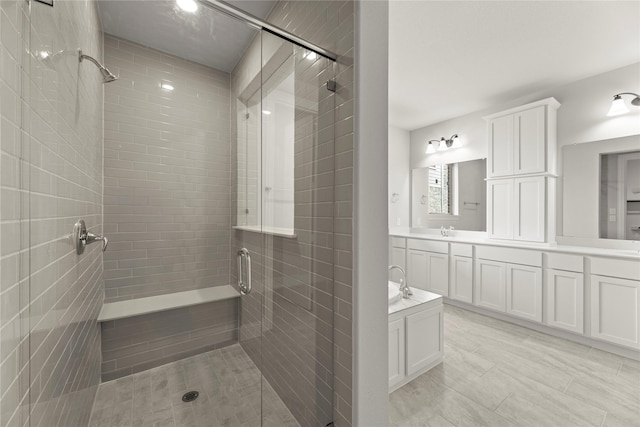 4100 Pond Cypress St, Aubrey, TX 76227 - bathroom with a sink, a shower stall, and double vanity