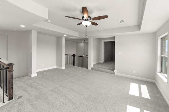4100 Pond Cypress St, Aubrey, TX 76227 - carpeted spare room featuring a ceiling fan, baseboards, visible vents, and a raised ceiling