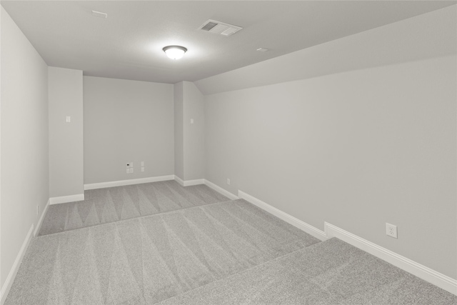 4100 Pond Cypress St, Aubrey, TX 76227 - unfurnished room featuring light colored carpet, baseboards, visible vents, and vaulted ceiling