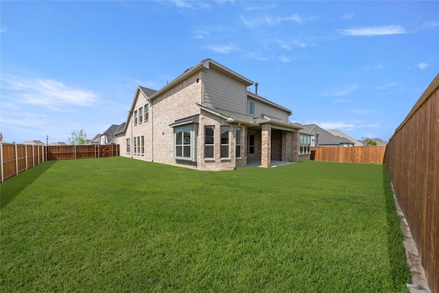 4100 Pond Cypress St, Aubrey, TX 76227 - rear view of property featuring brick siding, a fenced backyard, and a yard