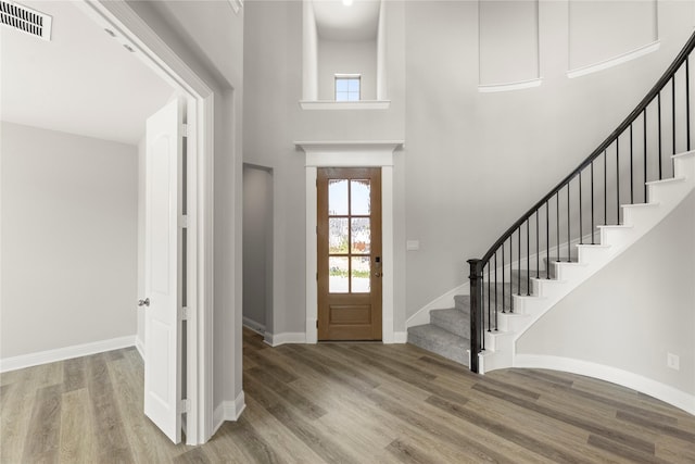4100 Pond Cypress St, Aubrey, TX 76227 - foyer featuring stairs, visible vents, a wealth of natural light, and wood finished floors