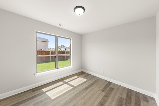 4100 Pond Cypress St, Aubrey, TX 76227 - unfurnished room with visible vents, baseboards, and wood finished floors