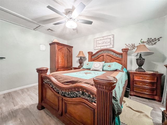 bedroom with light wood-style flooring, visible vents, ceiling fan, and baseboards