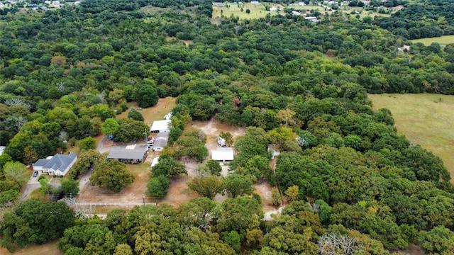 bird's eye view featuring a forest view