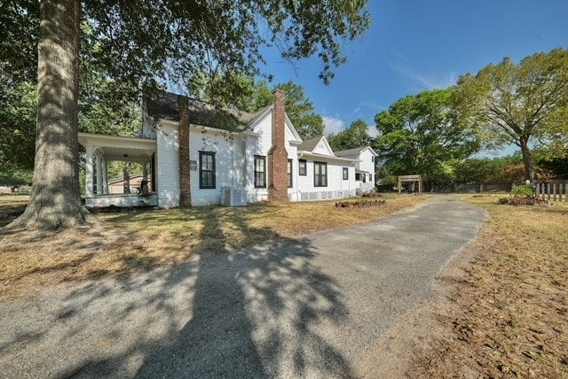 view of front of home with a carport