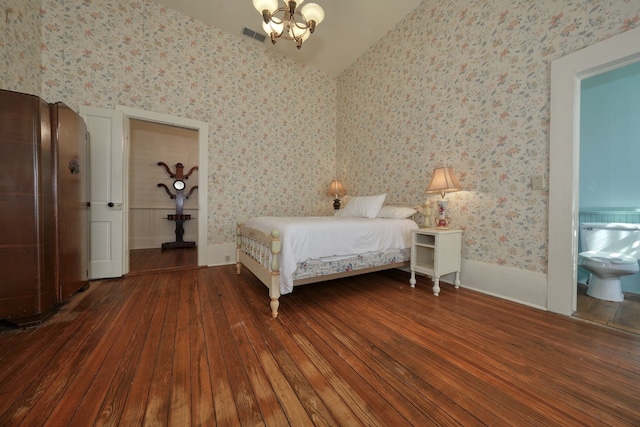 unfurnished bedroom featuring dark wood-type flooring and lofted ceiling