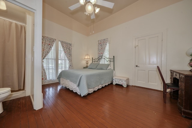 bedroom with ceiling fan and dark hardwood / wood-style flooring