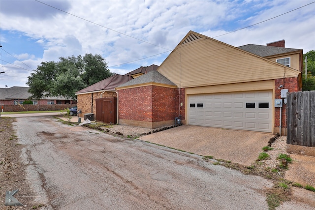 view of property exterior featuring a garage