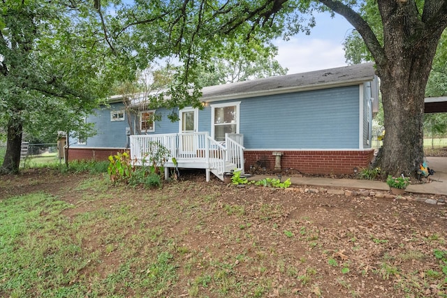 view of front of home with a deck