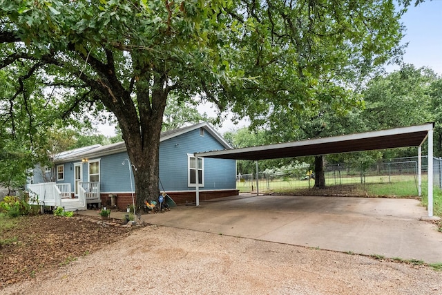 view of front of home featuring a carport