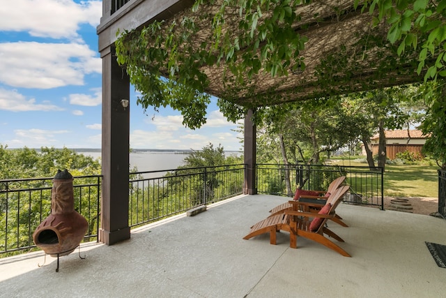 view of patio / terrace with a water view