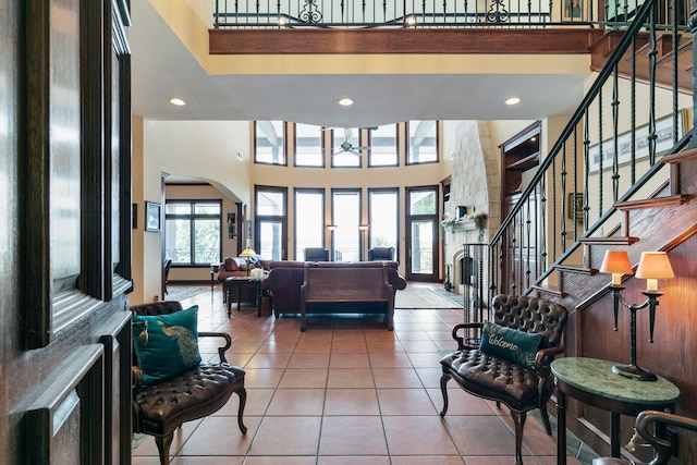 entrance foyer featuring a high ceiling and tile patterned flooring