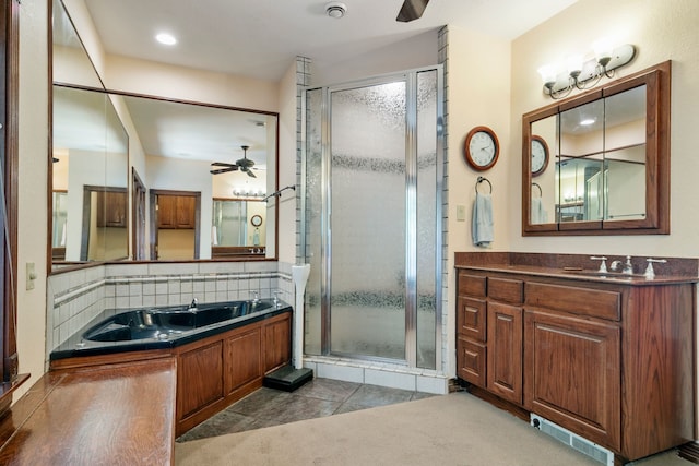 bathroom featuring vanity, backsplash, tile patterned floors, ceiling fan, and independent shower and bath