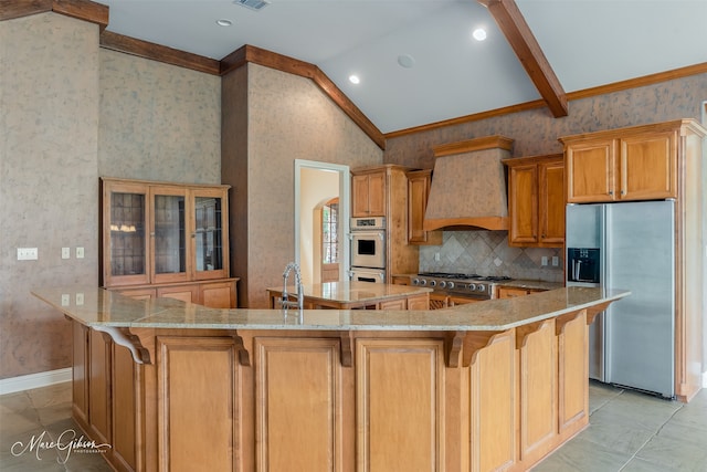 kitchen with light stone counters, stainless steel appliances, custom exhaust hood, lofted ceiling, and a large island