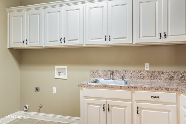 laundry area featuring cabinets, electric dryer hookup, gas dryer hookup, washer hookup, and sink