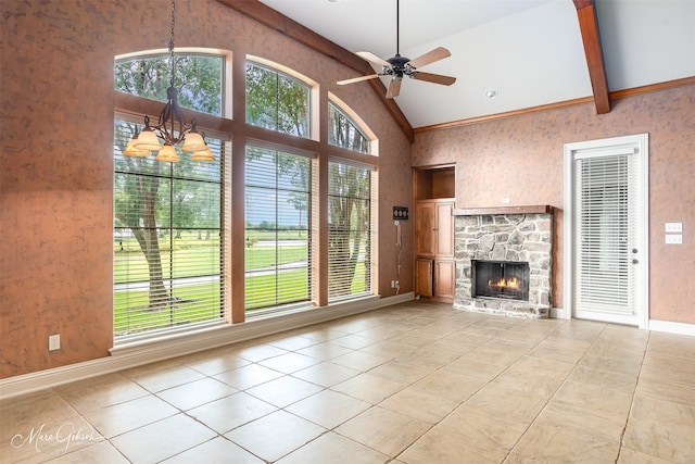 unfurnished living room featuring lofted ceiling, plenty of natural light, ceiling fan with notable chandelier, and a fireplace