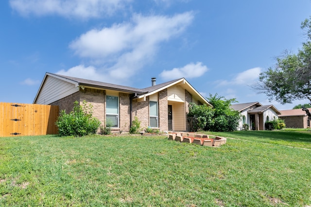 ranch-style house with a front yard