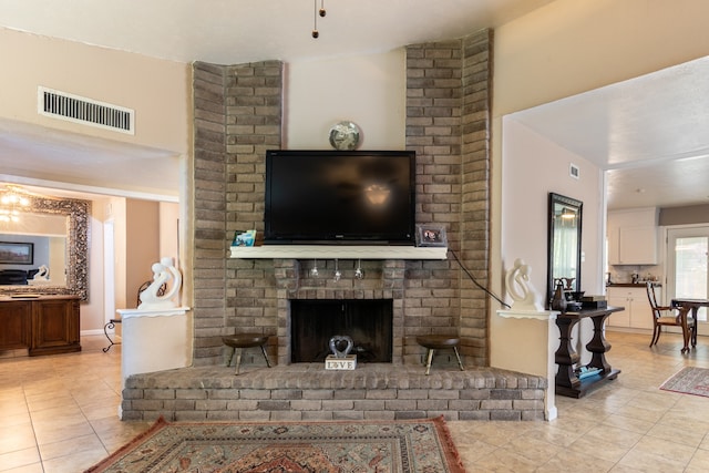 tiled living room featuring a fireplace