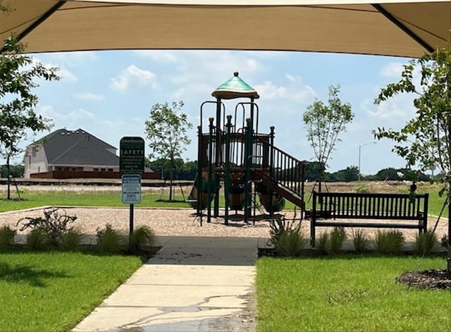 communal playground featuring a yard