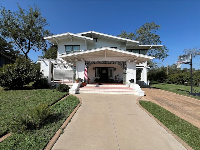 view of front of house with a front lawn and covered porch