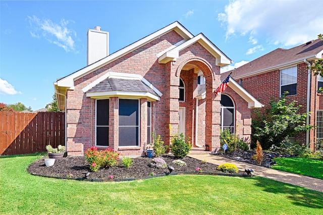 view of front of home with a front yard