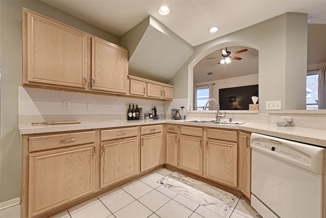 kitchen featuring white dishwasher, sink, light brown cabinets, ceiling fan, and light tile patterned flooring