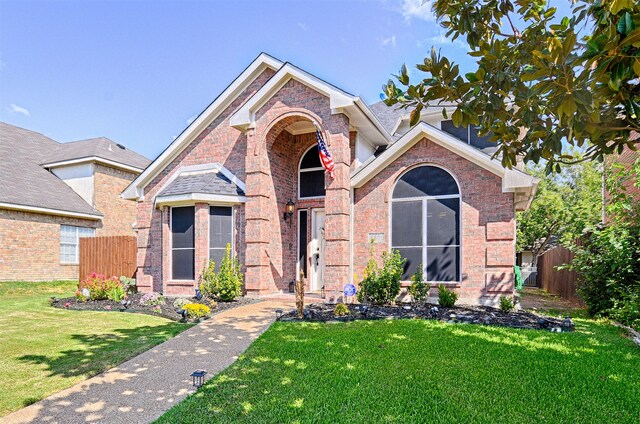 view of front of home with a front lawn