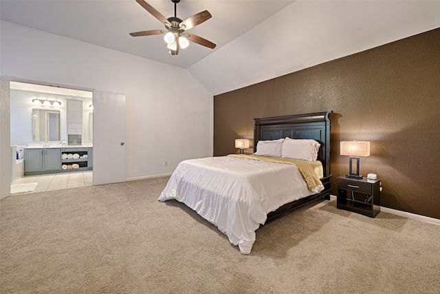 carpeted bedroom with ceiling fan and vaulted ceiling