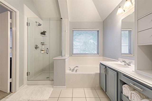 bathroom with lofted ceiling, vanity, a healthy amount of sunlight, and shower with separate bathtub