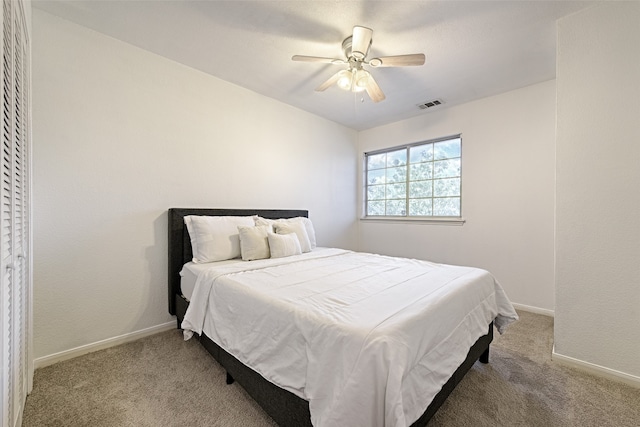 carpeted bedroom with ceiling fan