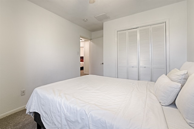 carpeted bedroom with a closet