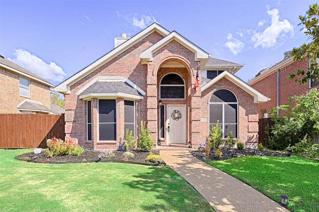 view of property featuring a front yard