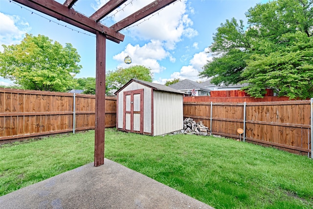 view of yard with a storage shed and a patio area