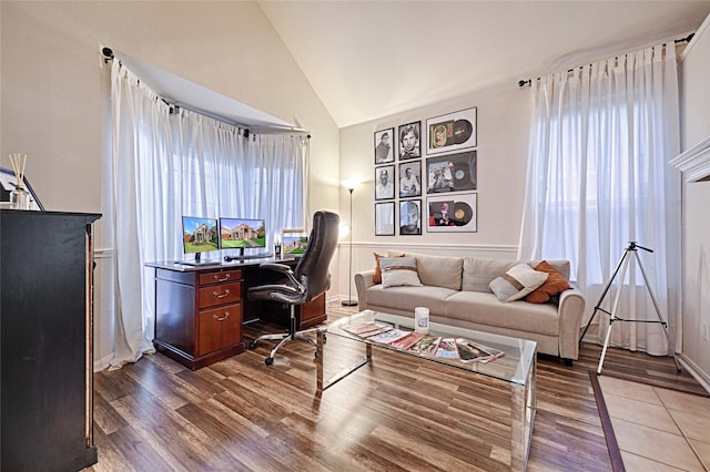 office area featuring high vaulted ceiling and dark hardwood / wood-style flooring