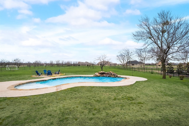 view of pool with a lawn and a patio