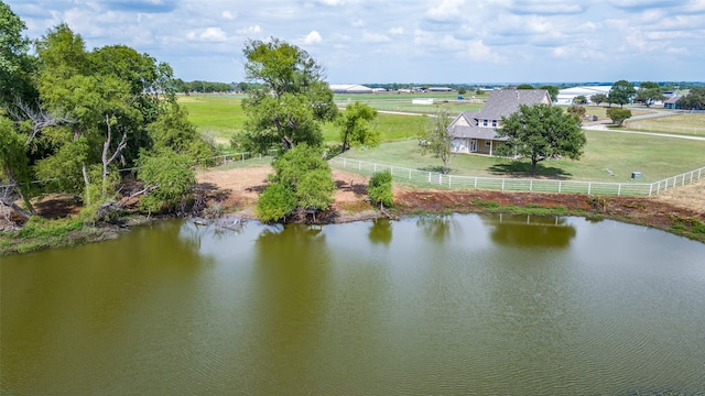 drone / aerial view with a rural view and a water view