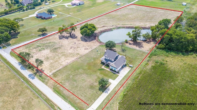 drone / aerial view featuring a water view and a rural view