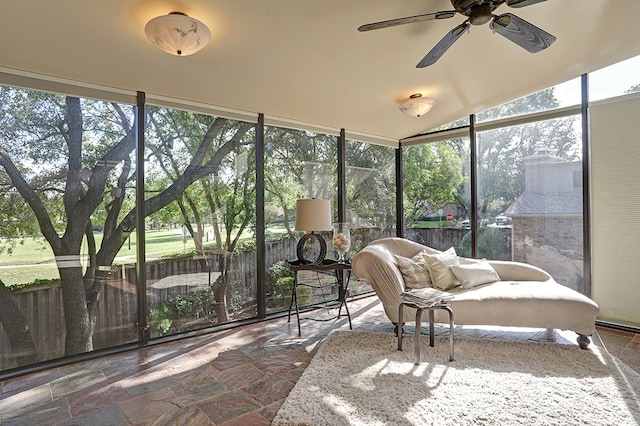 sunroom with a wealth of natural light and ceiling fan