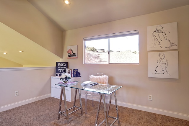 carpeted home office with lofted ceiling