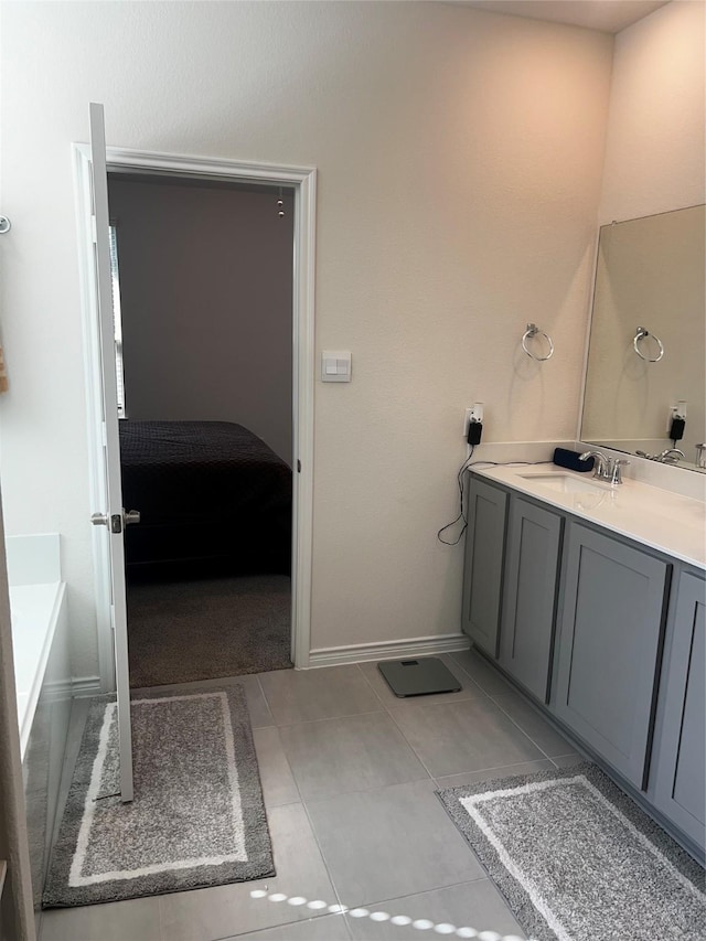 bathroom featuring baseboards and vanity