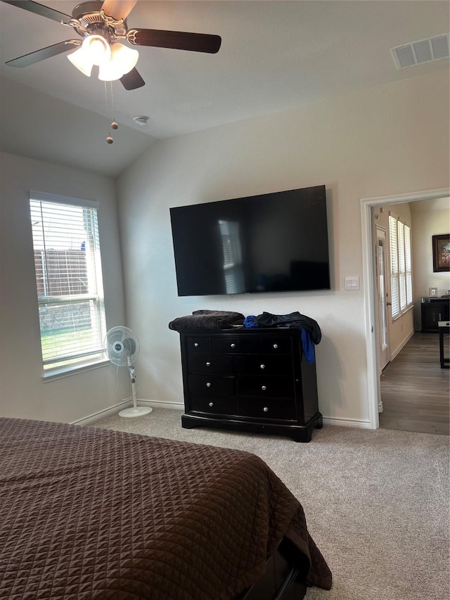 bedroom featuring visible vents, carpet, and multiple windows
