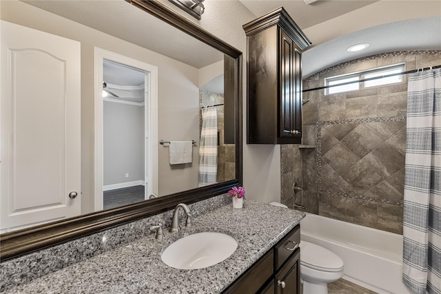 full bathroom with vanity, toilet, and shower / bath combo with shower curtain